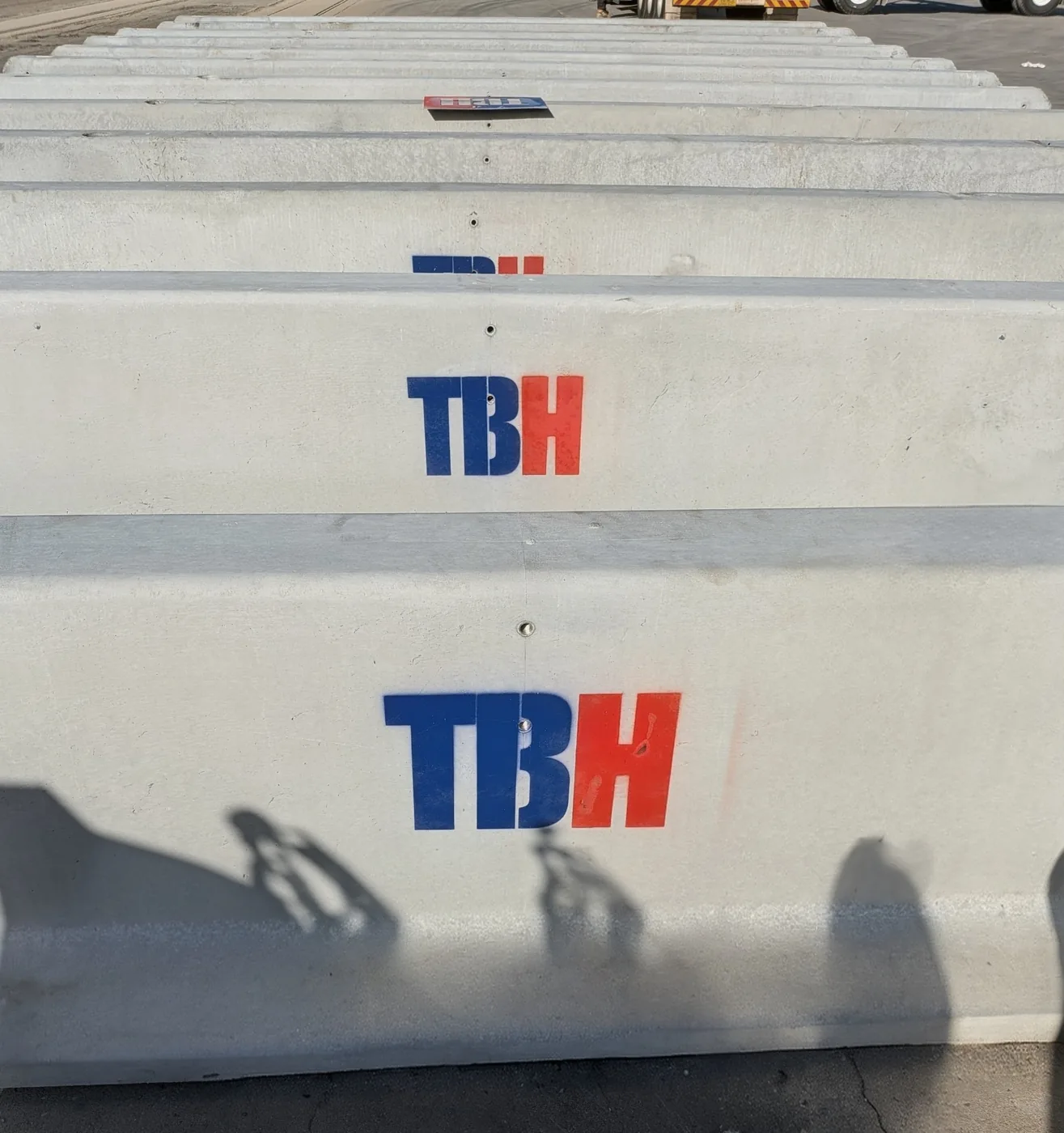 TBH-branded concrete jersey barriers stacked at the Townsville yard