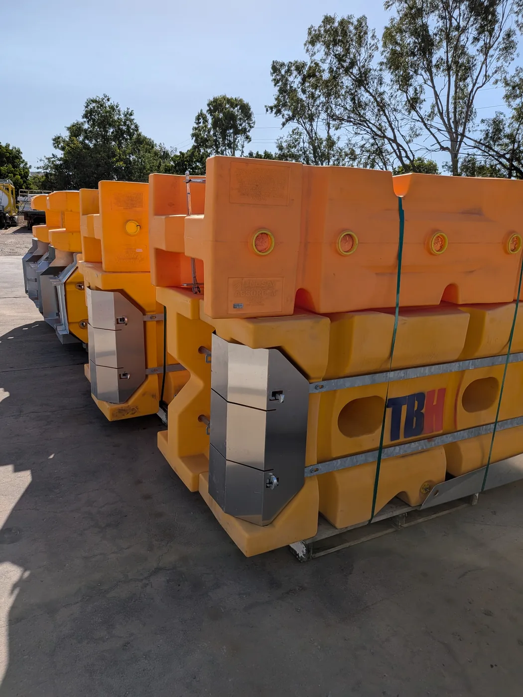 Absorb-M crash cushions and TBH-branded barriers ready for deployment
