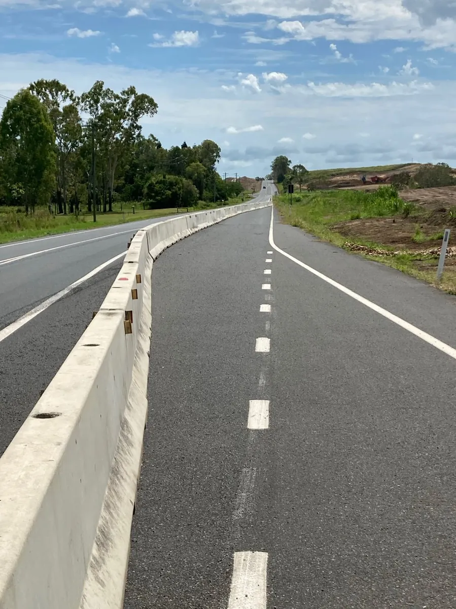 Concrete traffic barrier installation along a North Queensland highway